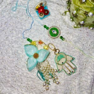 Bhaiya Bhabhi Blue Green Assorted Rakhi Set (Male Rakhi, Female Rakhi, Roli & Rice Basket)